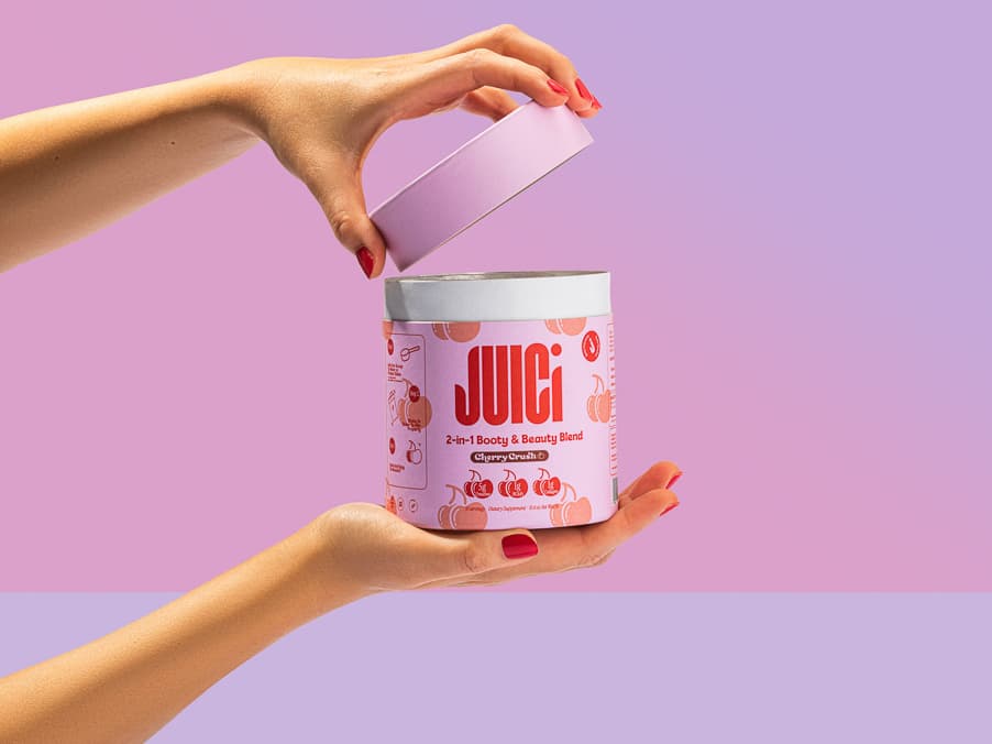 Drink product shown in a lifestyle setup with a hand model