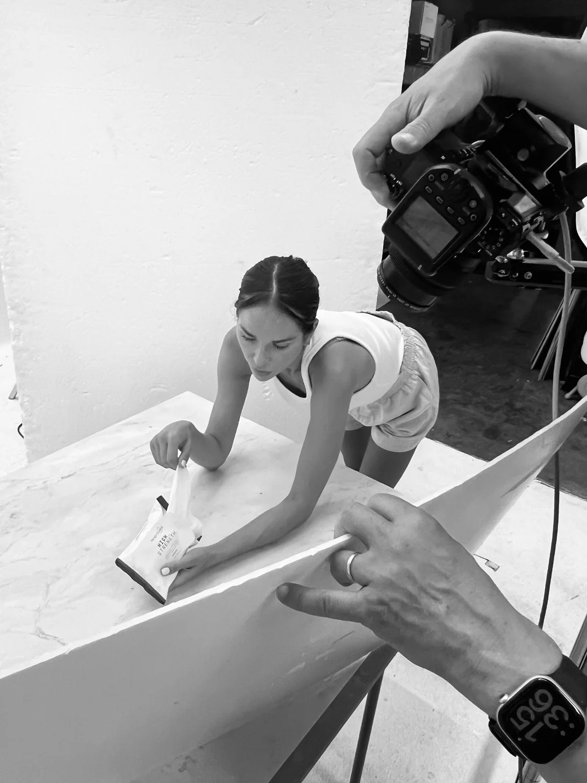 A photographer working close to the set during a model shoot at PMP