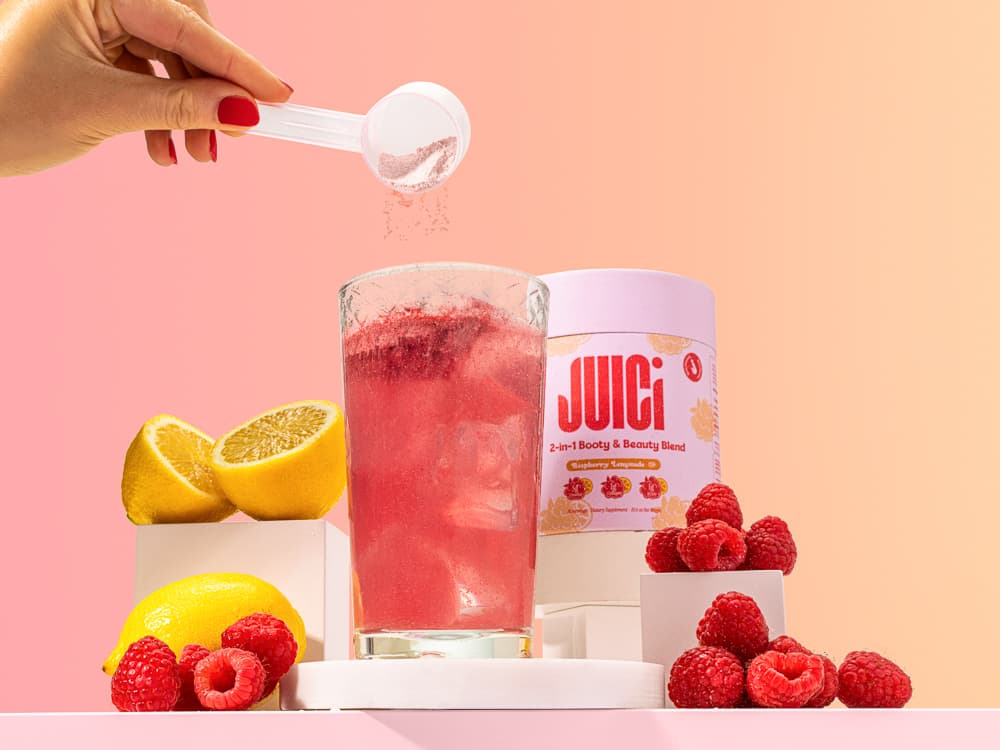 Juici Raspberry Lemonade vibrant pink pour lifestyle photography - beverage styling UK