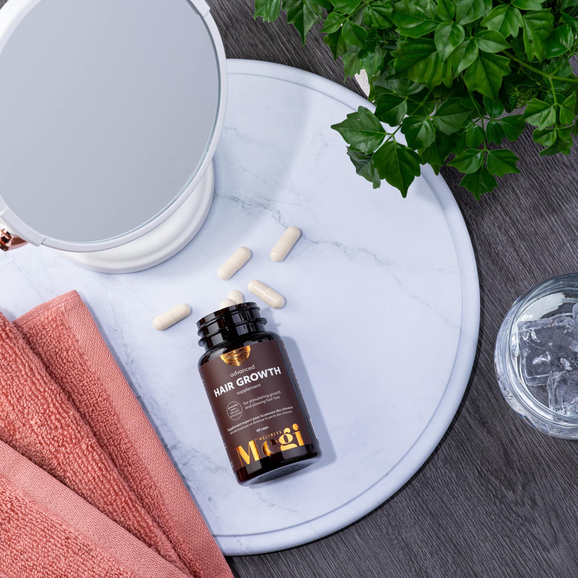 Hair Growth Supplement Lifestyle Hair growth supplement bottle lifestyle on marble tray - health & wellness product photography UK